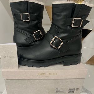 Jimmy Choo winter boots. Black leather fur lined with buckle accents